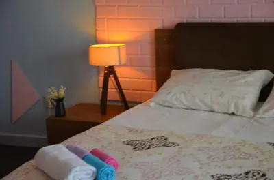 a bedroom with a bed with two towels and a lamp at Retro Suites in Istanbul