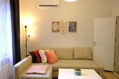 a living room with a couch and a table at Cactus Suites in Istanbul