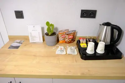 a counter top with a coffee maker and a tea kettle at Cactus Suites in Istanbul