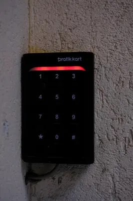 a black computer keyboard attached to a wall at Cactus Suites in Istanbul