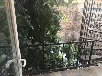 an open door to a balcony with a plant at Sun Comfort Hotel in Istanbul