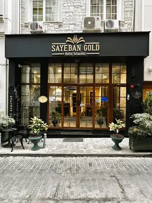 a store front of a building with a sign that reads save barn gold at Sayeban Gold Hotel in Istanbul