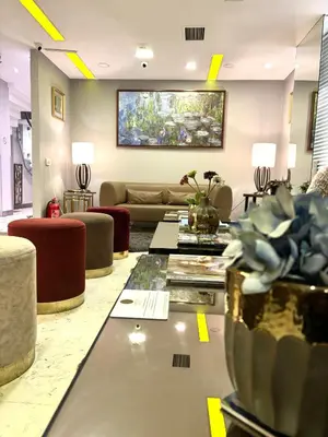 a living room with a couch and a table at Wame Suite Hotel Nisantasi in Istanbul