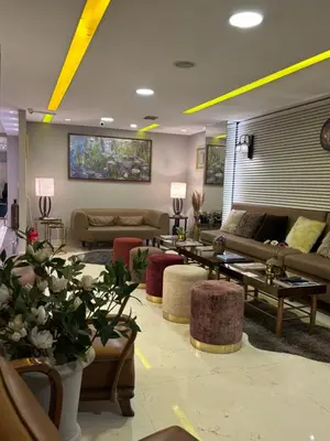 a living room with couches and tables and plants at Wame Suite Hotel Nisantasi in Istanbul