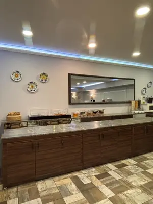 a kitchen with a counter with a large mirror at Wame Suite Hotel Nisantasi in Istanbul