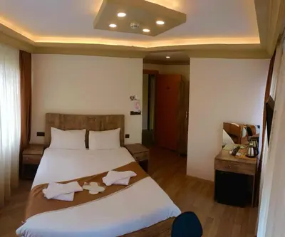 a bedroom with a large bed with towels on it at Vento in Istanbul