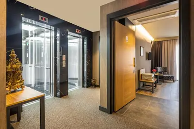 a hallway with a door leading to a room at Marius Hotel in Istanbul