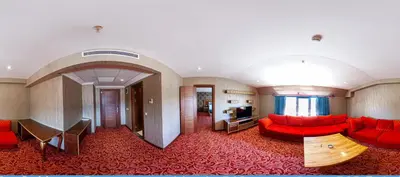 a living room with red couches and a television at Vois Hotel Atasehir & SPA in Istanbul