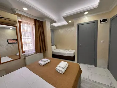 a bathroom with two towels sitting on a table at Grand Kybele Hotel in Istanbul