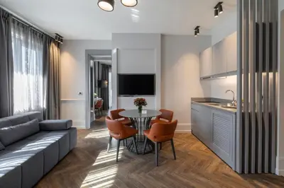 a living room with a couch and a table at Wish More Hotel Şişli in Istanbul