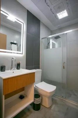 a bathroom with a toilet and a sink and a shower at BLAU GRÜN İSTANBUL OTEL in Istanbul