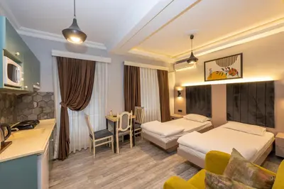 a hotel room with a bed and a table at Cirrus Suites in Istanbul