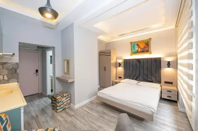a bedroom with a large white bed in a room at Cirrus Suites in Istanbul