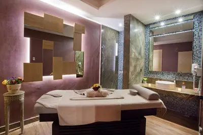 a bathroom with a massage table and a sink at The Parma Hotel & Spa Taksim in Istanbul