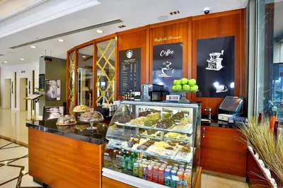 a bakery with a display case filled with food at The Parma Hotel & Spa Taksim in Istanbul