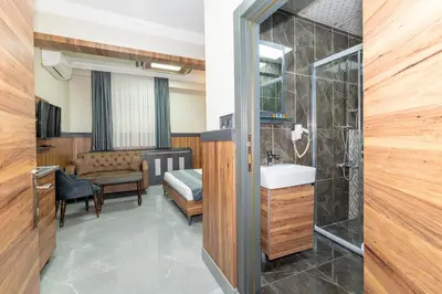 a bathroom with a sink and a shower at La Serena Taxim Hotel in Istanbul