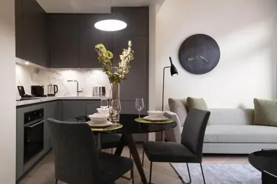 a kitchen and living room with a table and chairs at Marriott Executive Apartments Istanbul Fulya in Istanbul