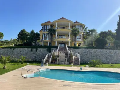 a large house with a swimming pool in front of it at Büyükbalkan Mansion, Charming Farmhouse, Altınova Yalova in Altınova
