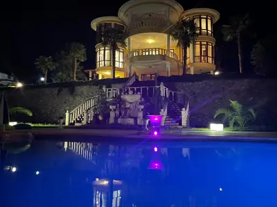 a house with a pool in front of it at night at Büyükbalkan Mansion, Charming Farmhouse, Altınova Yalova in Altınova