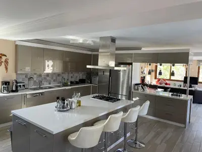 a kitchen with a large white island in a kitchen at Büyükbalkan Mansion, Charming Farmhouse, Altınova Yalova in Altınova