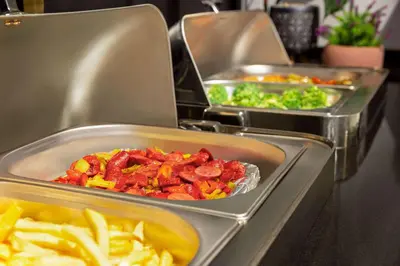 three trays of food on a counter with french fries at Trademark Collection By Wyndham Operla İstanbul Airport Hotels & Spa in Arnavutköy