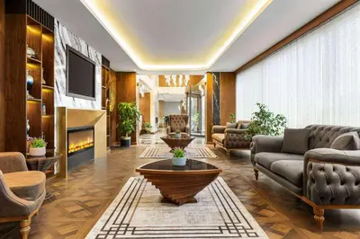 a living room with a couch and a table at Trademark Collection By Wyndham Operla İstanbul Airport Hotels & Spa in Arnavutköy