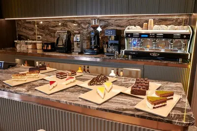 a buffet line with different types of cakes and desserts at Livinton İstanbul Ataşehir in Istanbul