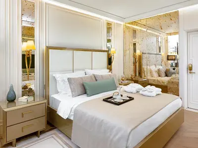 a bedroom with a large bed with a tray on it at Ulus G Residences in Istanbul