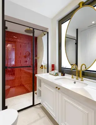 a bathroom with a sink and a large mirror at Ulus G Residences in Istanbul