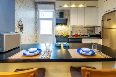 a kitchen with a table with two plates on it at Cihangir rooms in Istanbul