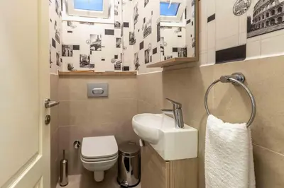 a small bathroom with a sink and a toilet at Cihangir rooms in Istanbul