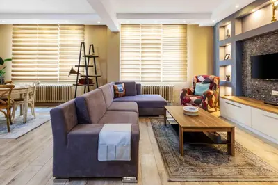 a living room with a couch and a table at Cihangir rooms in Istanbul