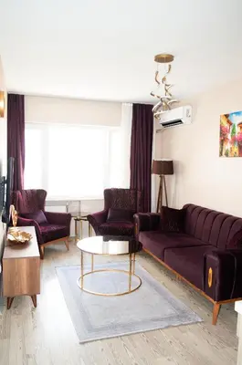 a living room with a couch and a table at Luxe Suite HA8 in Esenyurt