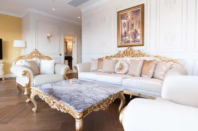 a living room with two white couches and a coffee table at Dekalb Hotel in Istanbul