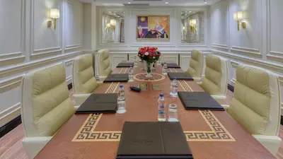 a conference room with a long table and chairs at Dekalb Hotel in Istanbul