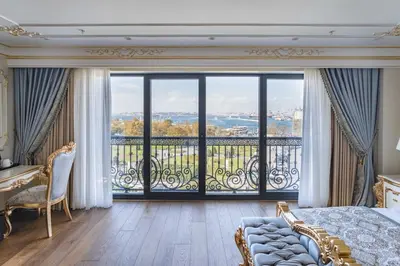 a bedroom with a bed and a large window at Dekalb Hotel in Istanbul