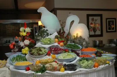 a table topped with bowls of food with birds on top at Beceren Hotel in Bursa