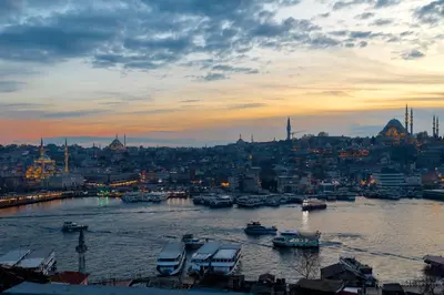 a view of a city with boats in the water at Union Hotel Karaköy in Istanbul