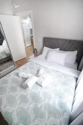 a bedroom with a large bed with two pillows on it at Classic Suite TS32 in Esenyurt