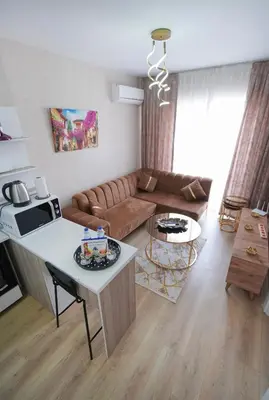 a living room with a couch and a table at Classic Suite TS22 in Esenyurt