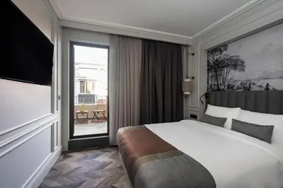 a hotel room with a bed and a large window at Livro Hotel in Istanbul