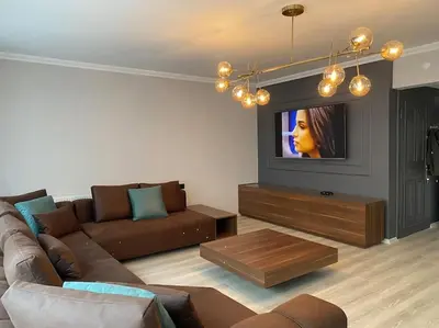 a living room with a couch and a tv at Whole Apartment at The Heart of Sisli Nisantasi K in Istanbul
