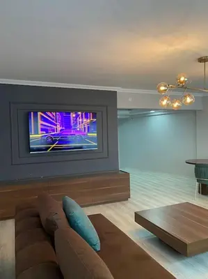 a living room with a couch and a tv at Whole Apartment at The Heart of Sisli Nisantasi K in Istanbul