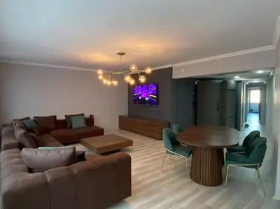 a living room with a couch and a table at Whole Apartment at The Heart of Sisli Nisantasi K in Istanbul