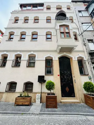 a large white building with windows and a door at PALMERA ART HOUSE in Istanbul
