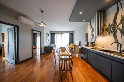 a kitchen and living room with a table and chairs at Benesta Guest Teori in Istanbul