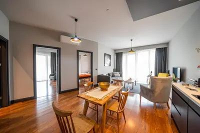 a kitchen and living room with a table and chairs at Benesta Guest Teori in Istanbul