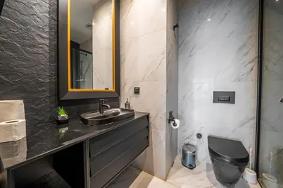 a bathroom with a sink and a toilet at Benesta Guest Teori in Istanbul