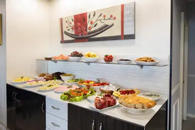 a buffet line with many different types of food at Park Çağlayan Hotel in Istanbul
