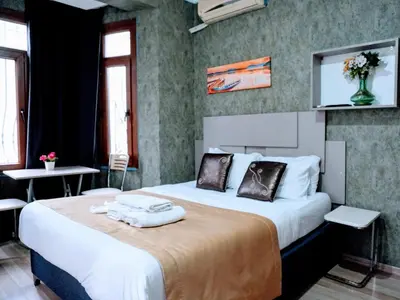 a hotel room with a large bed with towels on it at Easeinn in Istanbul